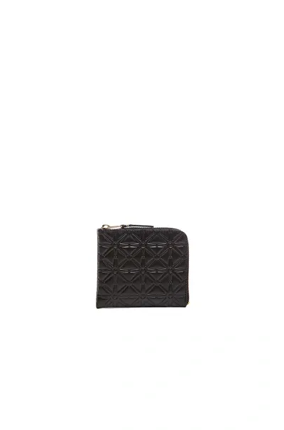 Comme Des Garçons Small Star Embossed Zip Wallet In Black