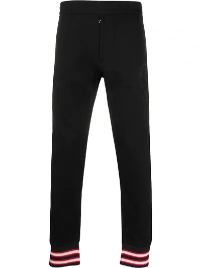 Alexander Mcqueen Skull Detail Track Pants In Black