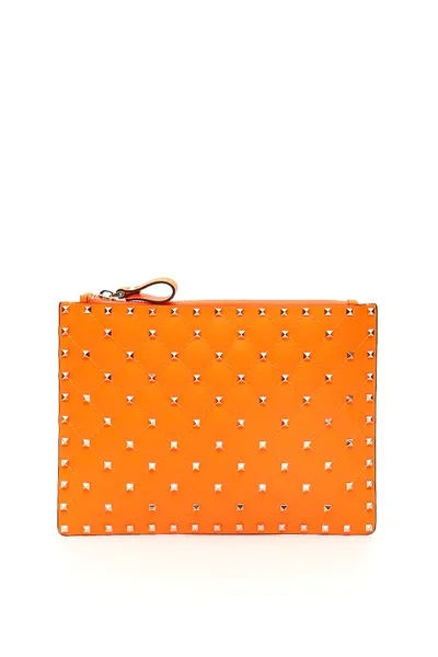 Valentino Garavani Neon Spike Pouch In Orange