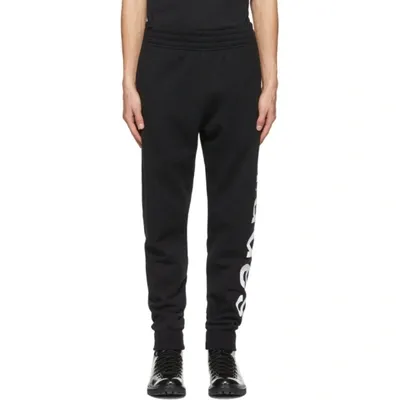 Etudes Studio Etudes Logo Printed Tapered Leg Pants In Black