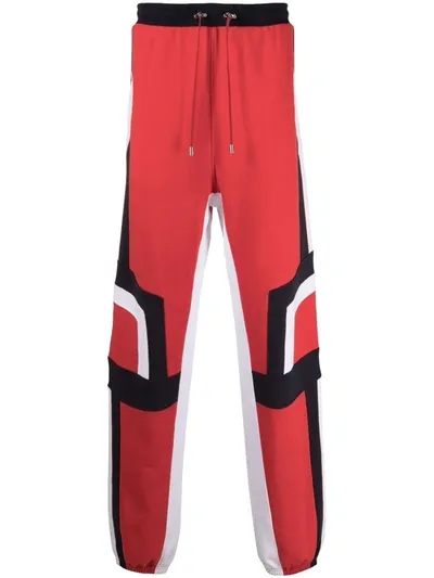 Balmain Tapered Panelled Cotton-jersey Sweatpants In Rouge