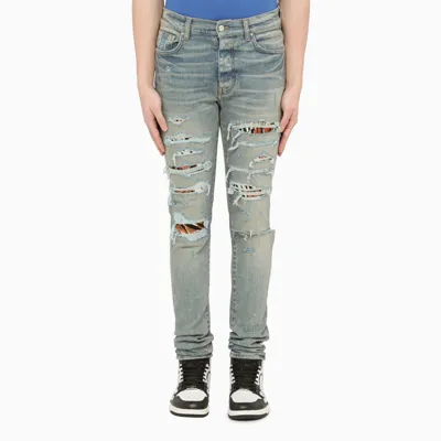 Amiri Skinny Jeans With Tiger Tears In Light Blue