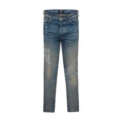 Amiri Distressed Logo Jeans In Clay Indigo