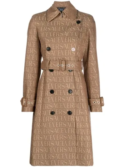 Versace La Vacanza All Over Logo Trench Coat In Beige