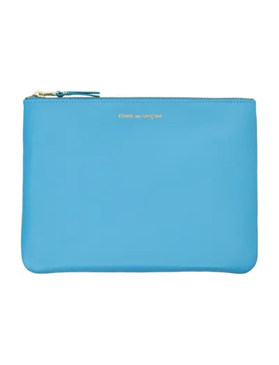 Comme Des Garçons Wallet Logo Embossed Wallet In Blue