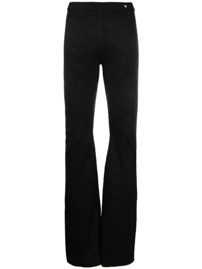 Versace Greca-jacquard Flared Trousers In Nero