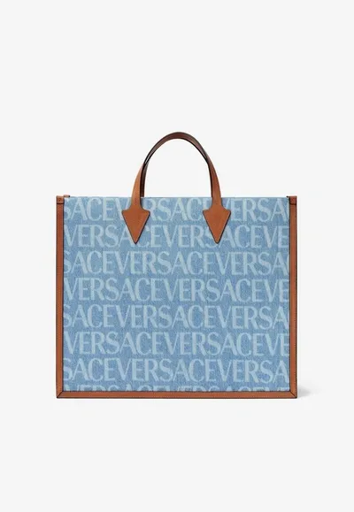 Versace All-over Logo Denim Tote Bag In Blue