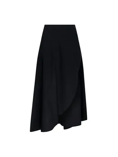 Alaïa Fluid Asymetric Midi Skirt In Black