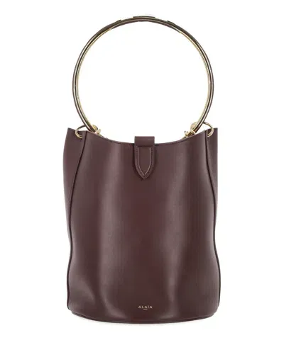 Alaïa Ring Bucket Bag In Brown