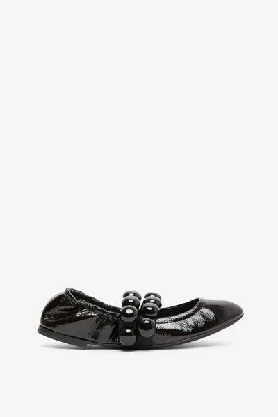 Alaïa Sphere Ballet Flats In Black