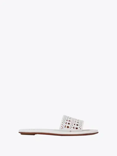 Alaïa Flat Mules In Vienne Calfskin In White