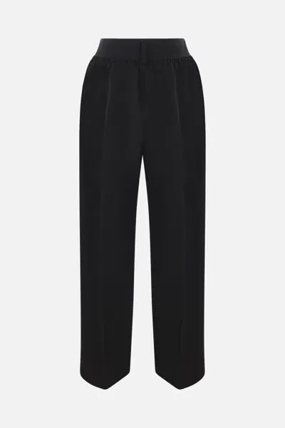 Alainpaul Trousers In Black