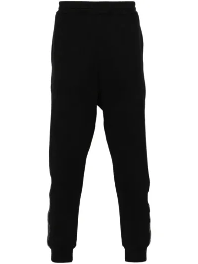 Alexander Mcqueen Logo-stripe Tapered Track Pants In Black