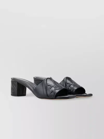 Alexander Mcqueen Block Heel Logo Embossed Sandals In Black