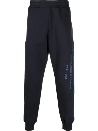 Alexander Mcqueen Graffiti-print Cotton Track Pants In Blue