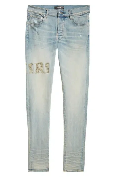 Amiri Baroque Logo Distressed Nonstretch Denim Jeans In Antique Indigo