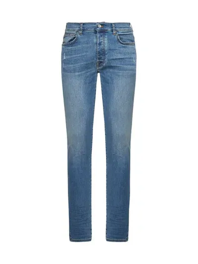 Amiri Logo Patch Distressed Skinny Jeans In Blue