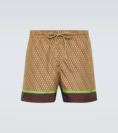 Gucci Logo Printed Swim Trunks In Beige