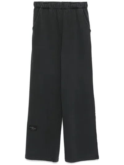 Joshua Sanders Flocked-slogan Track Pants In Schwarz