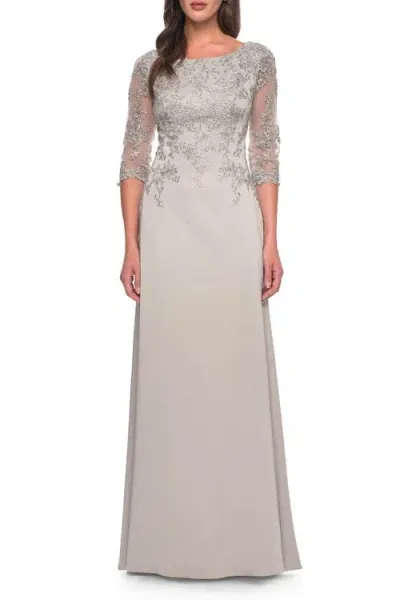 La Femme Jersey Gown With Boat Neckline And Lace Detailing In Silver