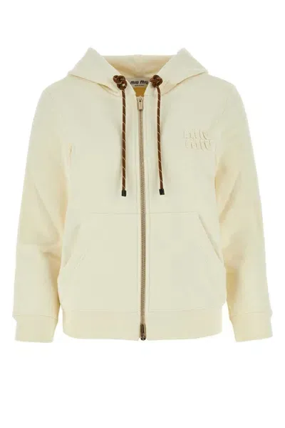 Miu Miu Logo Patch Zipped Hoodie In Beige