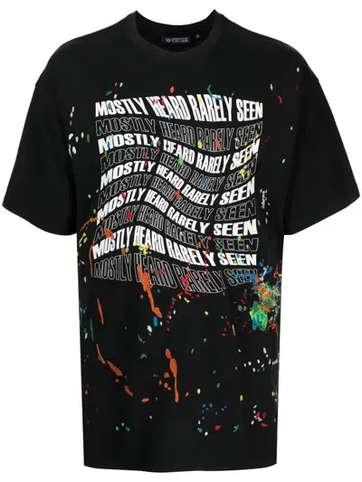 Mostly Heard Rarely Seen Warped-logo Paint-splatter T-shirt In Black