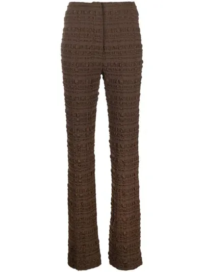 Nanushka Juna Seersucker-texture Slim-fit Trousers In Brown