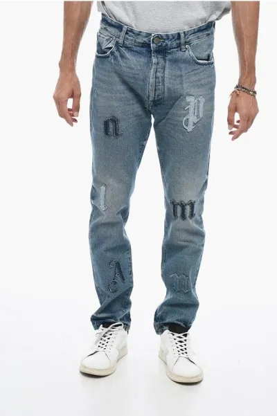 Palm Angels Distressed Denims With Patchworks In Blue