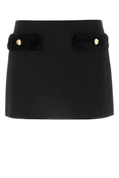 Prada Logo Engraved Mini Skirt In Black