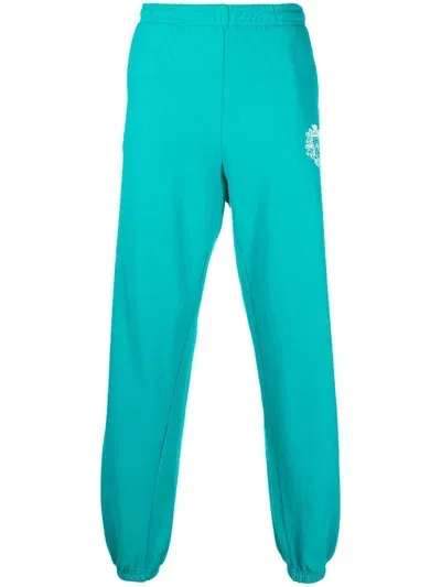 Sporty And Rich Crest Logo Print Track Pants In Blue