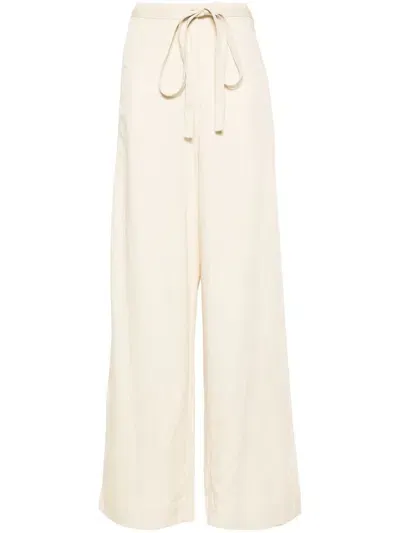 Toteme Pre Tie Waist Fluid Trousers In Neutral