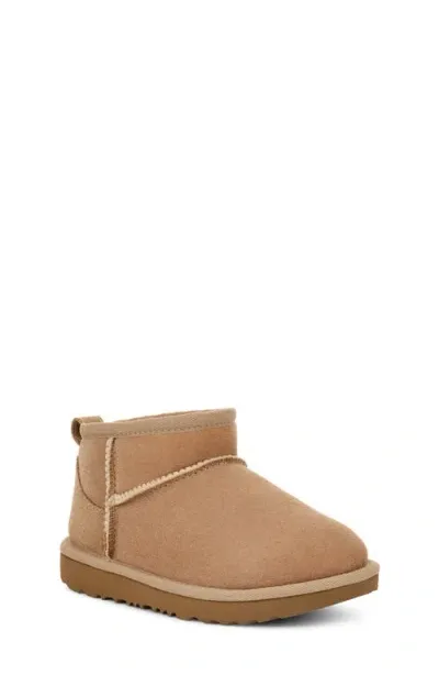 Ugg(r) Kids' Classic Ultra Water Resistant Genuine Shearling Mini Boot In Sand