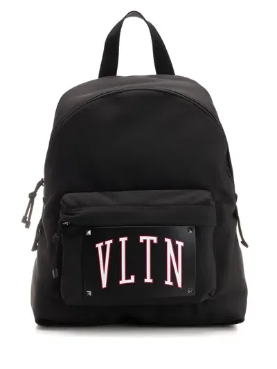 Valentino Garavani Rockstud Logo Printed Zip In Multicolor