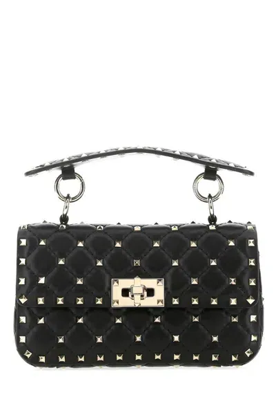 Valentino Garavani Handbags. In Black