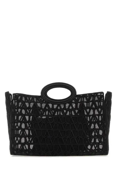 Valentino Garavani Handbags. In Black