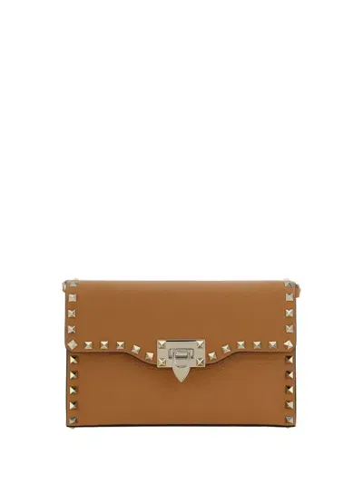 Valentino Garavani Rockstud Foldover Top Small Shoulder Bag In Brown