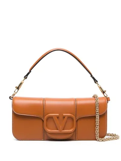 Valentino Garavani Locò Clutch Bag In Brown