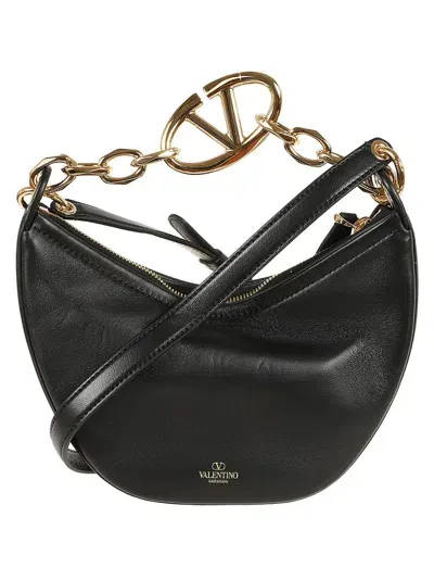 Valentino Garavani Handbags. In Black