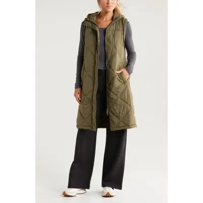 Zella Long Hooded Puffer Vest In Olive Night