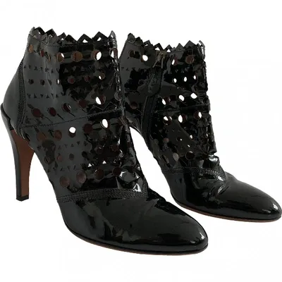 Pre-owned Alaïa Patent Leather Ankle Boots In Black