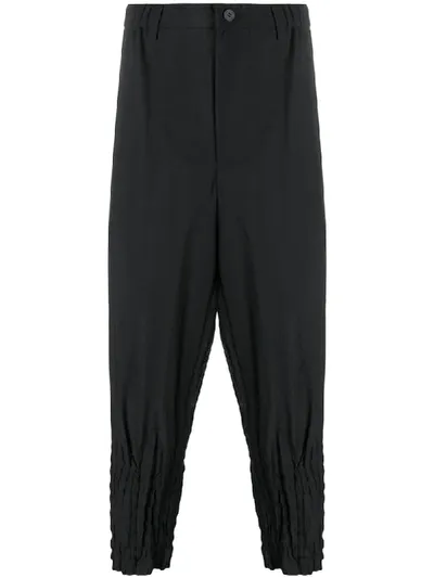 Issey Miyake Pleated-hem Cropped Pinstriped Trousers In Black