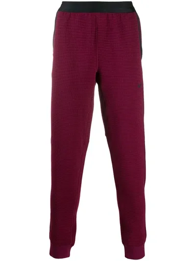 Nike Textured Slim-fit Trackpants In Red