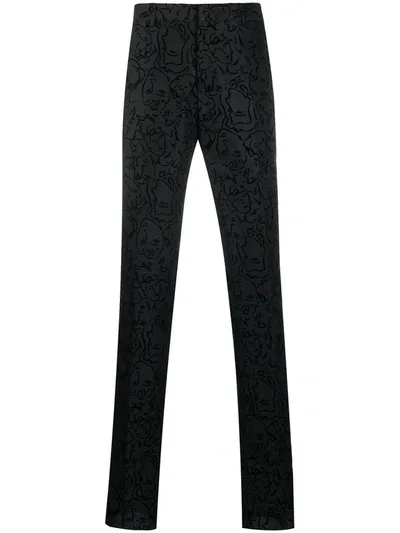 Moschino Patterned Slim-fit Trousers In Black