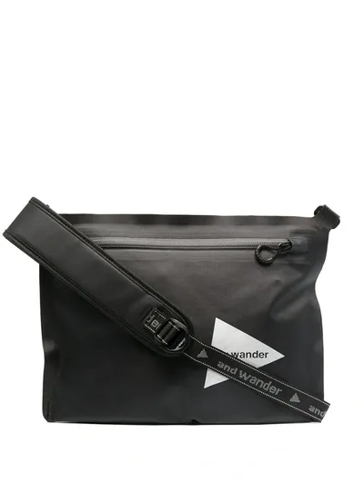 And Wander Logo Print Shoulder Bag In Black